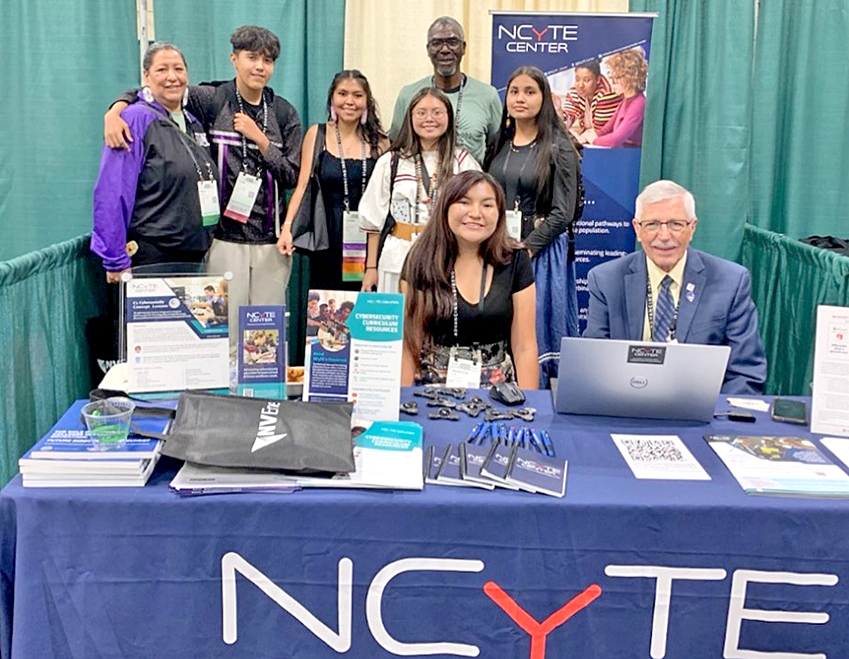 Photo of Mescalero Apache High School Dual Credit Students and Science Teachers with ENMU-Ruidoso Cybersecurity Director/Professor and National Cybersecurity Training and Education Center (NCyTE) CoPI Stephen Miller. 