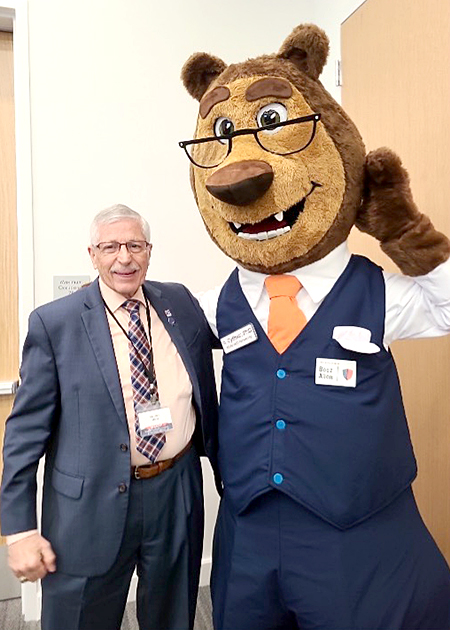 Photo of Stephen Miller with USTA mascot