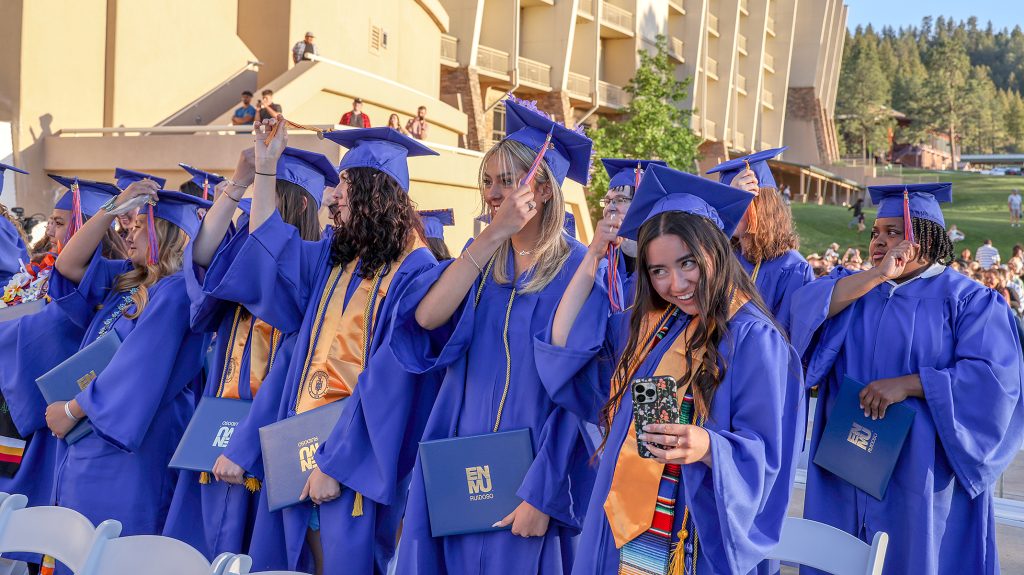 Photo of 2023 graduates turning tassels to other side of cap