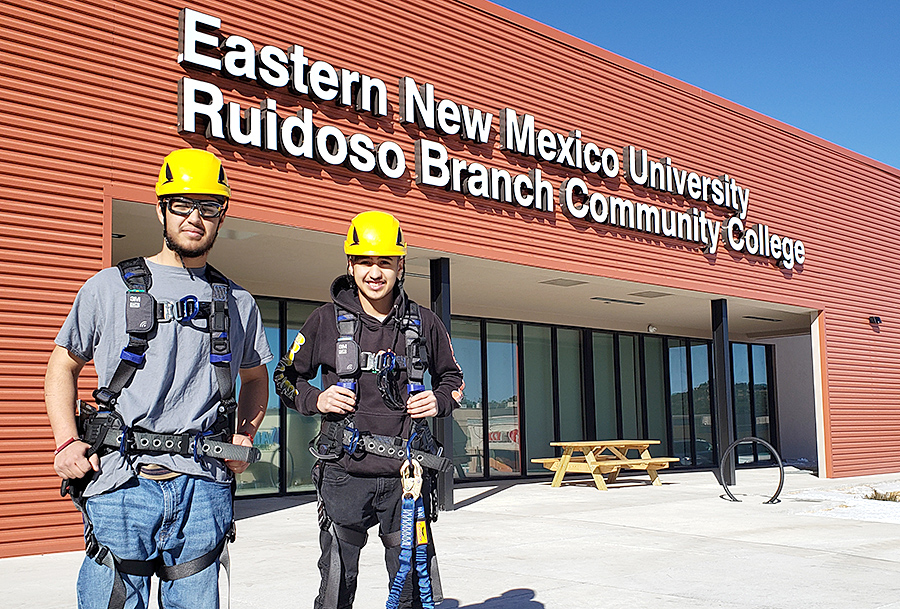 Photo of 2 male students in wind turbine climbing gear