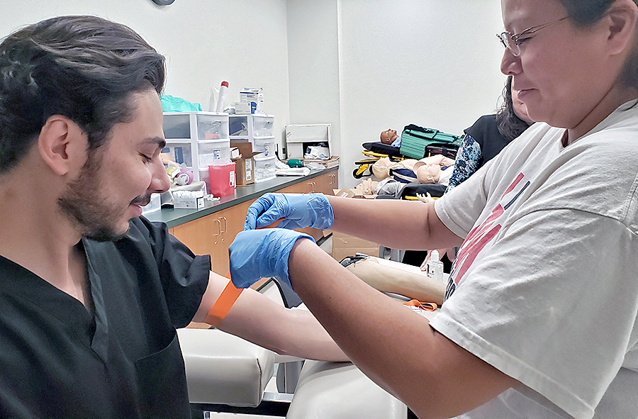 Photo of phlebotomy students in training