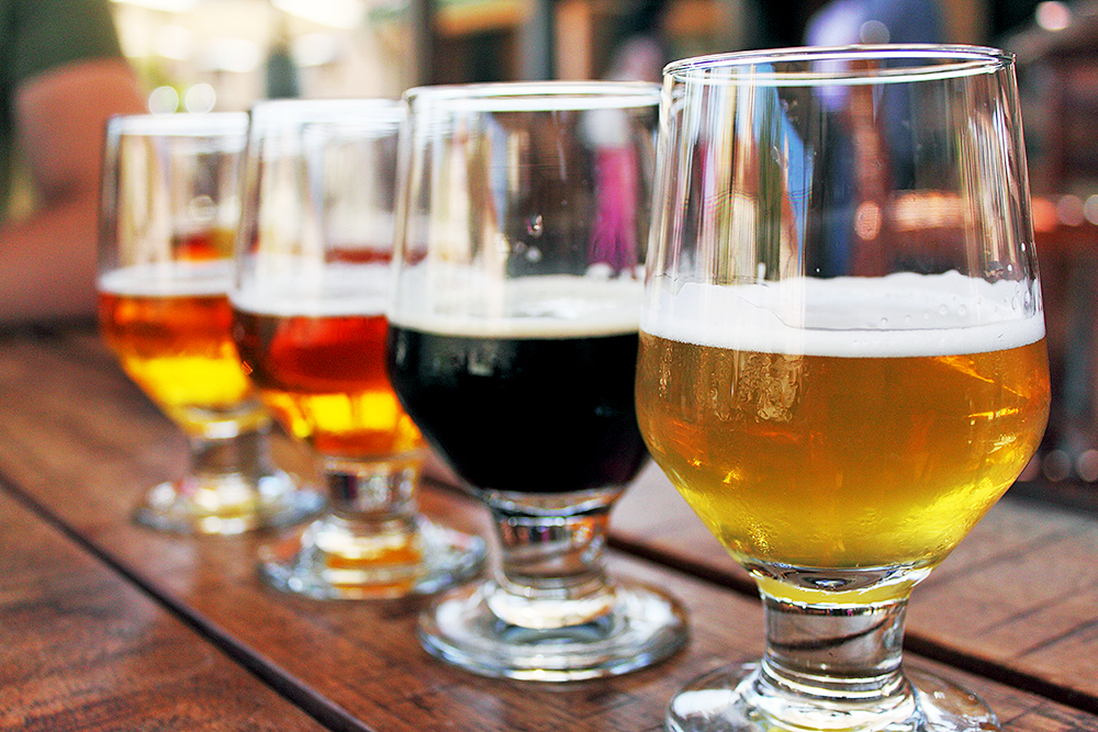 Photo of four glasses with different types of beer