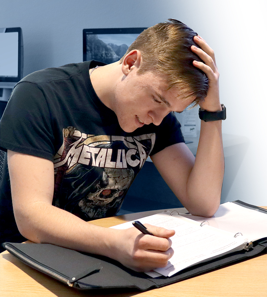 Male student in Writing Center, looking frustrated