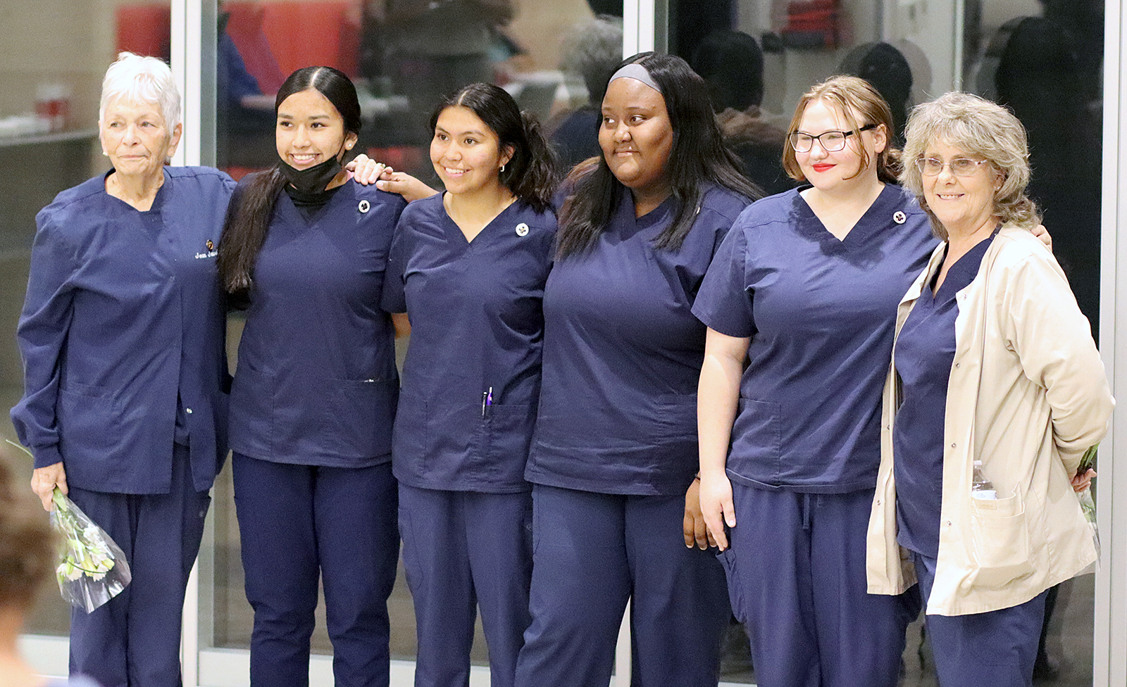Photo of Nursing Assistant instructors and students at pinning ceremony