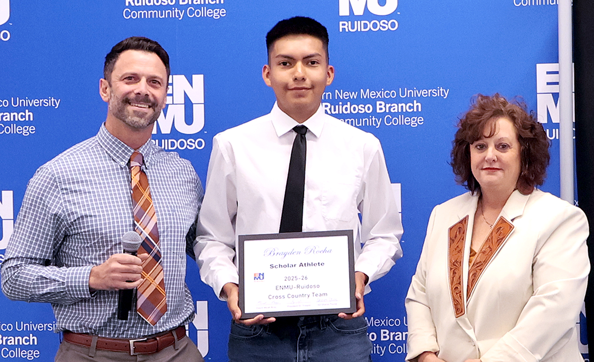 Cross Country Coach Micah Bray with Brayden Rocha and Interim Athletic Coordinator Sharon Young