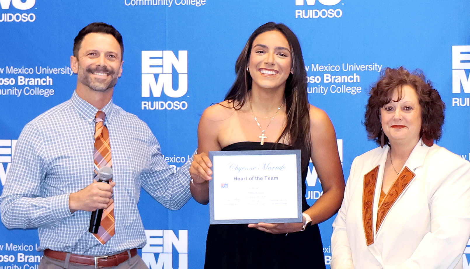 Cross Country Coach Micah Bray with Chyenne Marrufo and Interim Athletic Coordinator Sharon Young