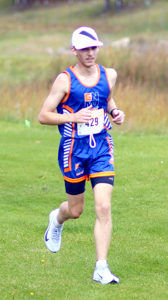 Photo of Cole Hanshew running in cross country meet