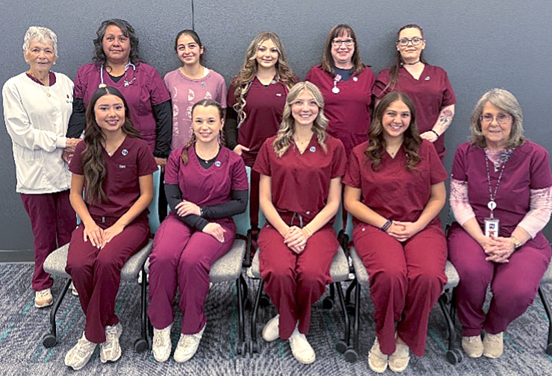 Photo of CNA instructors Jean Jewell and Dorothy Roberts with graduating CNA students