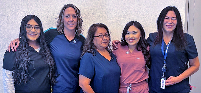 Photo of Phlebotomy instructor Bobbie Owen-Simonson with graduating Phlebotomy students