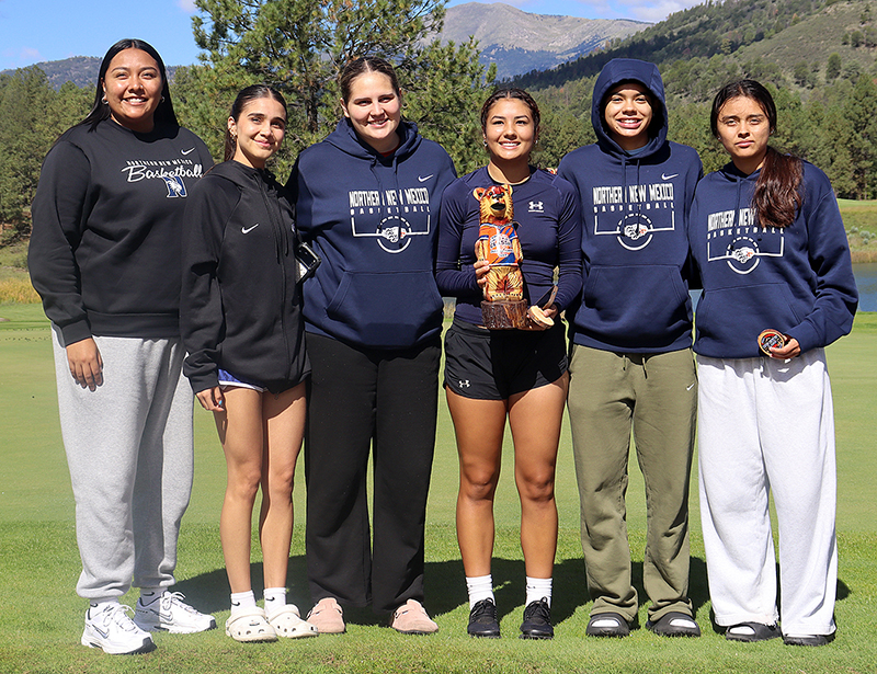 Photo of Women's Team from Northern New Mexico College with carved bear trophy for top team at Inn of the Mountain Gods, Mescalero, on Oct. 1, 2026